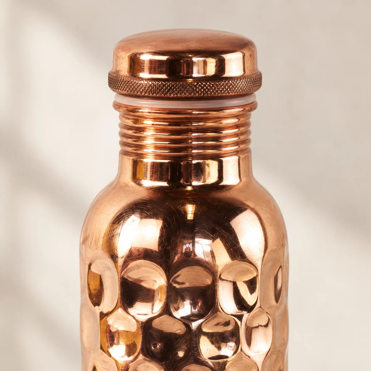 Rounded copper cap and textured grip ring