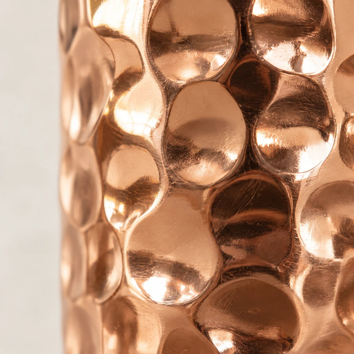 Close detail of the large hammered copper facets