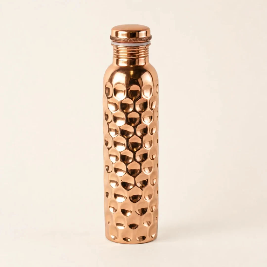 The Wellthorne hammered copper bottle, shown in full before a slow close-up of its finish.